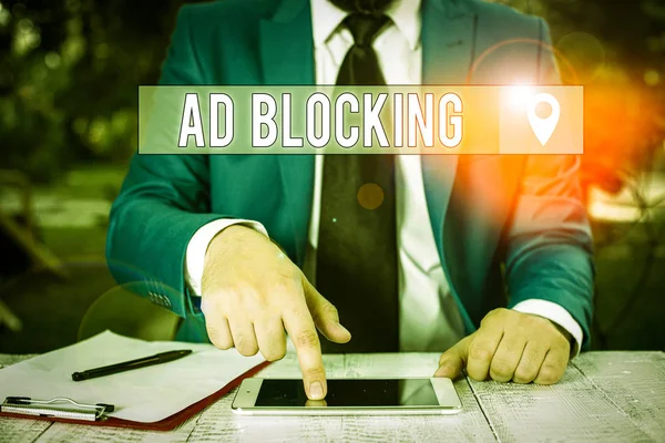 Writing note showing Ad Blocking. Business photo showcasing program that will remove different kinds of advertising from web Businessman with pointing finger in front of him.