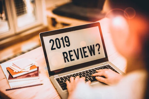 Text sign showing 2019 Review Question. Conceptual photo remembering past year events main actions or good shows woman laptop computer office supplies technological devices inside home. — Stockfoto