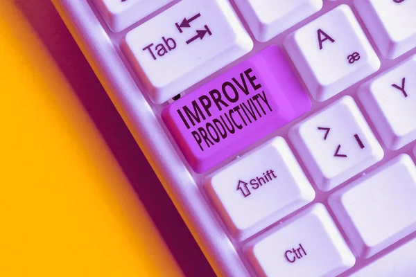 Text sign showing Improve Productivity. Conceptual photo to increase the machine and process efficiency White pc keyboard with empty note paper above white background key copy space.