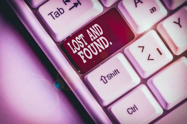 Text sign showing Lost And Found. Conceptual photo a place where lost items are stored until they reclaimed White pc keyboard with empty note paper above white background key copy space.