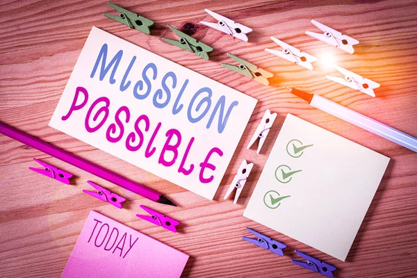 Conceptual hand writing showing Mission Possible. Business photo showcasing special assignment that is given to a demonstrating or group Colored crumpled papers wooden floor background clothespin. — Stock Photo, Image