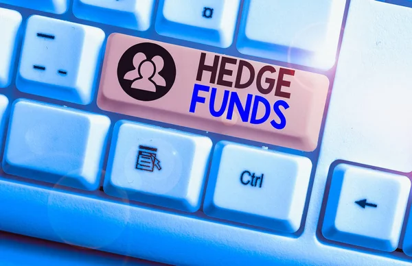 Text sign showing Hedge Funds. Conceptual photo basically a fancy name for an alternative investment partnership White pc keyboard with empty note paper above white background key copy space.