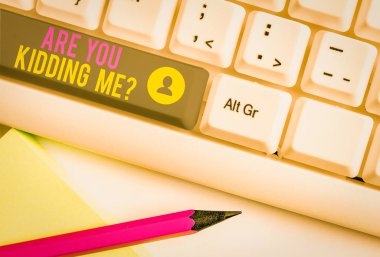 Text sign showing Are You Kidding Me Question. Business photo text Expression of Disbelief or could not be true White pc keyboard with empty note paper above white background key copy space