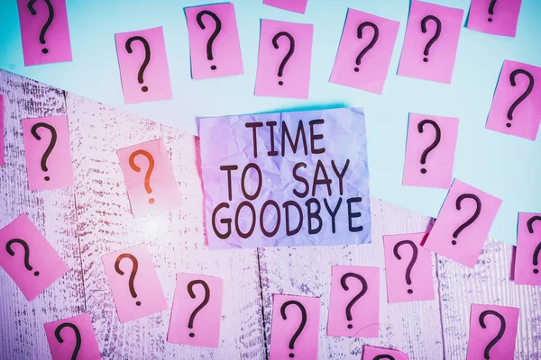 Text sign showing Time To Say Goodbye. Conceptual photo Bidding Farewell So Long See You Till we meet again Scribbled and crumbling papers with thick cardboard above wooden table.