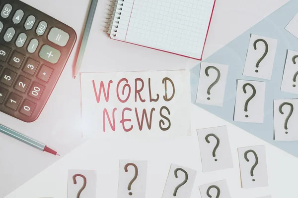 Writing note showing World News. Business photo showcasing global noteworthy information about recent or important events Mathematics stuff and writing equipment above pastel colours background. — Stock Photo, Image