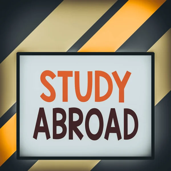 Text sign showing Study Abroad. Conceptual photo live in a foreign country and attend a foreign university Front close up view big blank rectangle abstract geometrical background.