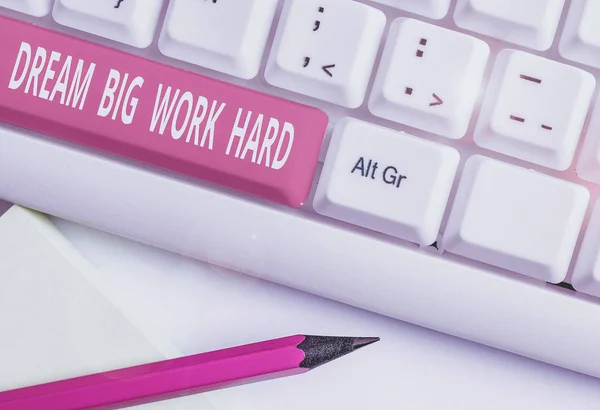 Text sign showing Dream Big Work Hard. Business photo text Believe in yourself and follow the dreams and goals White pc keyboard with empty note paper above white background key copy space