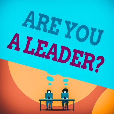 Text sign showing Are You ALeader Question. Conceptual photo Set direction Create inspiring visions Motivate others Two men sitting behind desk each one laptop sharing blank thought bubble.