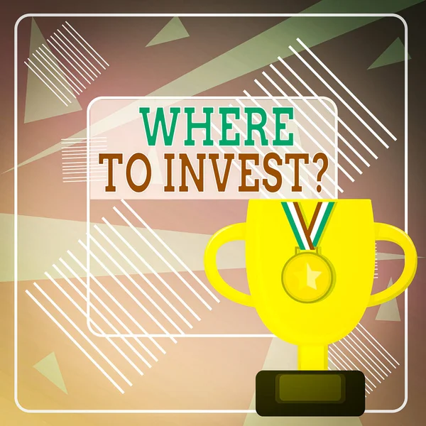 Word writing text Where To Invest Question. Business concept for asking someone about place to put money into Trophy Cup on Pedestal with Plaque Decorated by Medal with Striped Ribbon.