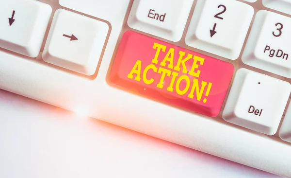 Text sign showing Take Action. Conceptual photo do something official or concerted to achieve aim with problem White pc keyboard with empty note paper above white background key copy space. — Stock Photo, Image