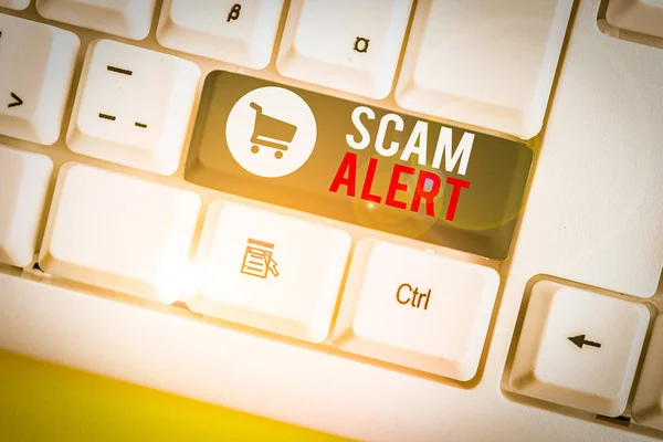 Conceptual hand writing showing Scam Alert. Business photo text warning someone about scheme or fraud notice any unusual White pc keyboard with note paper above the white background. — Stock Photo, Image