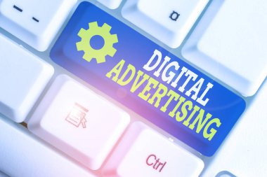 Writing note showing Digital Advertising. Business concept for marketing of products or services using internet