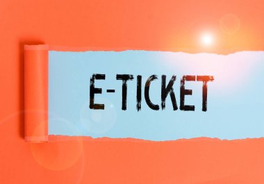 Text sign showing E Ticket. Business photo text Digital ticket that is as valid as a paper ticket or its equivalent Cardboard which is torn in the middle placed above a plain table backdrop