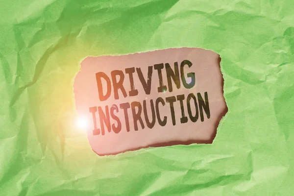 Word writing text Driving Instruction. Business photo showcasing detailed information on how driving should be done Green crumpled ripped colored paper sheet centre torn colorful background