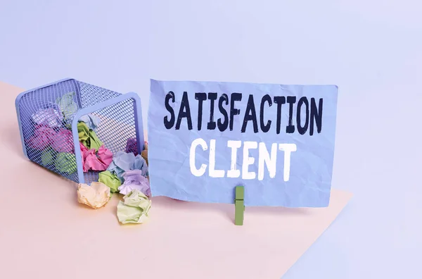 Conceptual hand writing showing Satisfaction Client. Concept meaning benefits which customers get from purchasing products Trash bin crumpled paper clothespin reminder office supplies