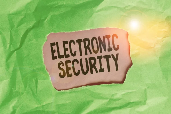 Word writing text Electronic Security. Business photo showcasing electronic equipment that perform security operations Green crumpled ripped colored paper sheet centre torn colorful background