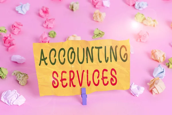 Handwriting text writing Accounting Services. Conceptual photo analyze financial transactions of a business or a demonstrating Colored crumpled papers empty reminder pink floor background clothespin