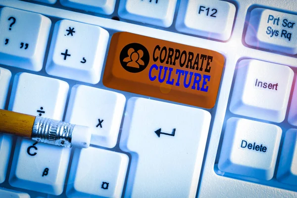 Text sign showing Corporate Culture. Business photo showcasing pervasive values and attitudes that characterize a company White pc keyboard with empty note paper above white background key copy space
