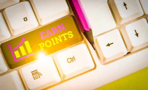 Text sign showing Earn Points. Business photo text getting praise or approval for something you have done White pc keyboard with empty note paper above white background key copy space