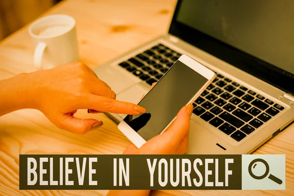 Writing note showing Believe In Yourself. Business concept for common piece of advice that you can do everything woman with laptop smartphone and office supplies technology