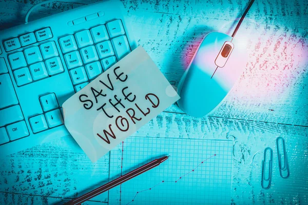 Text sign showing Save The World. Business photo showcasing Protect the environment and the living species Ecosystem Writing equipments and computer stuffs placed above classic wooden table