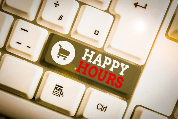 Conceptual hand writing showing Happy Hours. Concept meaning when drinks are sold at reduced prices in a bar or restaurant White pc keyboard with note paper above the white background