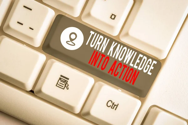 Conceptual hand writing showing Turn Knowledge Into Action. Concept meaning Apply what you have learned Leadership strategies White pc keyboard with note paper above the white background