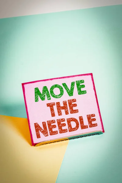 Word writing text Move The Needle. Business photo showcasing Make a noticeable difference in something do better Paper placed tilted above buffer wire on soft pastel multi colours backdrop