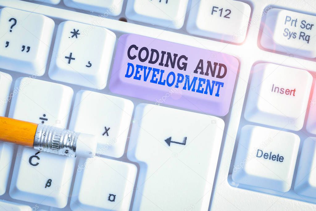 Word writing text Coding And Development. Business photo showcasing Programming Building simple assembly Programs White pc keyboard with empty note paper above white background key copy space