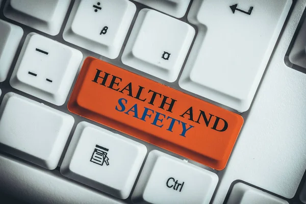 Word writing text Health And Safety. Business photo showcasing procedures intended to prevent accident in workplace White pc keyboard with empty note paper above white background key copy space