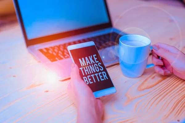 Writing note showing Make Things Better. Business concept for Do something to Improve oneself Be the Change Act woman with laptop smartphone and office supplies technology
