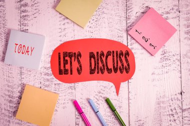 Text sign showing Let S Discuss. Business photo text asking someone to talk about something with demonstrating or showing Ballpoints pens blank colored speech bubble sticky notes wooden background clipart
