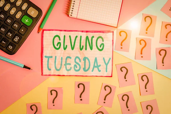 Handwriting text Giving Tuesday. Conceptual photo international day of charitable giving Hashtag activism Mathematics stuff and writing equipment above pastel colours background