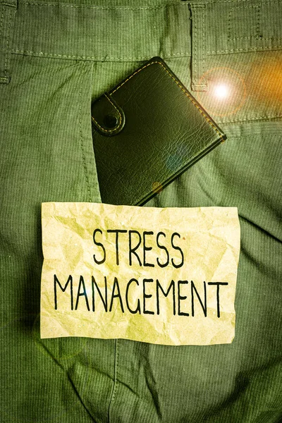 Word writing text Stress Management. Business photo showcasing method of limiting stress and its effects by learning ways Small little wallet inside man trousers front pocket near notation paper