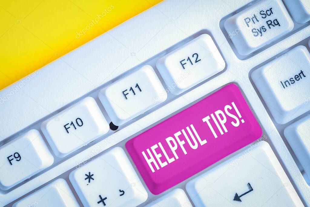 Word writing text Helpful Tips. Business photo showcasing advices given to be helpful knowledge in life White pc keyboard with empty note paper above white background key copy space