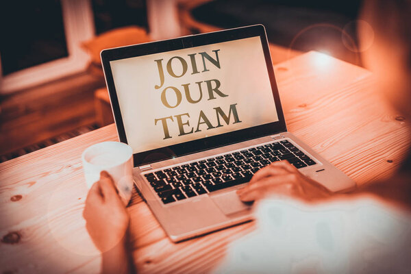 Handwriting text writing Join Our Team. Conceptual photo inviting someone to join in your local group or company woman laptop computer smartphone mug office supplies technological devices