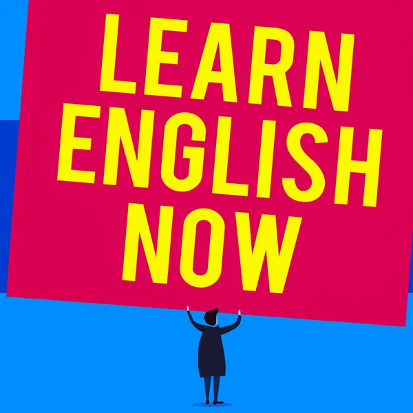 Writing note showing Learn English Now. Business concept for gain or acquire knowledge and skill of english language Short hair woman standing dress hands up holding blank rectangle