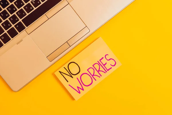 Word writing text No Worries. Business photo showcasing an expression used to say that everything is all right Slim trendy silver open laptop square sticky notepad colored background