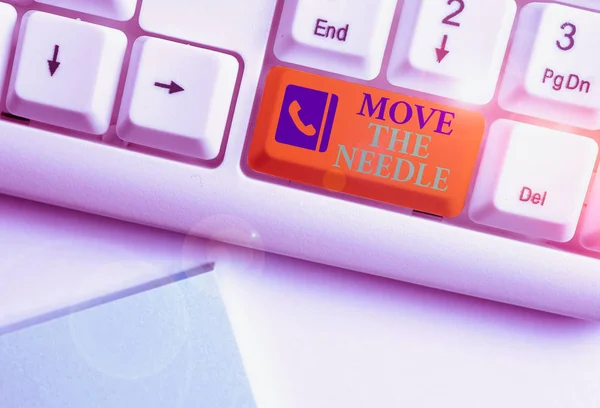 Text sign showing Move The Needle. Business photo showcasing Make a noticeable difference in something do better White pc keyboard with empty note paper above white background key copy space