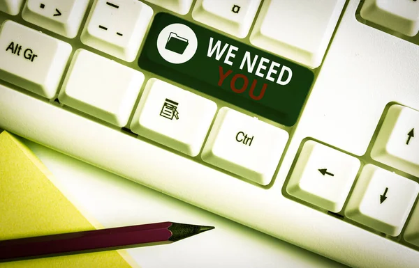 Writing note showing We Need You. Business concept for to fulfill the needs of the assignment duty or obligation White pc keyboard with note paper above the white background