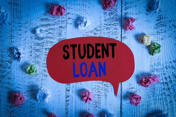 Conceptual hand writing showing Student Loan. Concept meaning financial assistance designed to help students pay for school Colored speech bubble paper balls wooden rustic vintage background