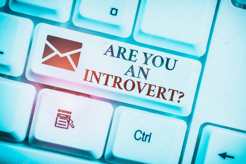 Text sign showing Are You An Introvertquestion. Business photo text demonstrating who tends to turn inward mentally White pc keyboard with empty note paper above white background key copy space