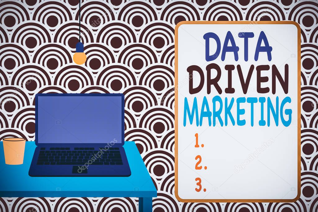 Conceptual hand writing showing Data Driven Marketing. Concept meaning Strategy built on Insights Analysis from interactions Front view laptop lying on wooden desktop light bulb glass