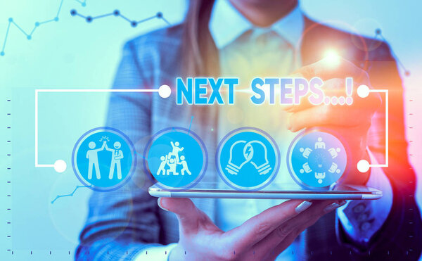 Writing note showing Next Steps. Business concept for something you do after you have finished doing first one