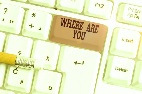 Word writing text Where Are You. Business photo showcasing Give us your location address direction point of reference White pc keyboard with empty note paper above white background key copy space