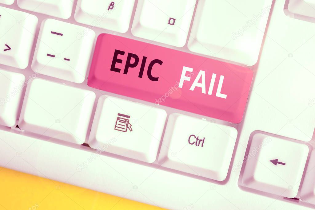 Conceptual hand writing showing Epic Fail. Concept meaning a spectacularly embarrassing mistake Humiliating situation White pc keyboard with note paper above the white background