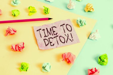 Writing note showing Time To Detox. Business concept for when you purify your body of toxins or stop consuming drug Colored crumpled papers empty reminder blue yellow clothespin