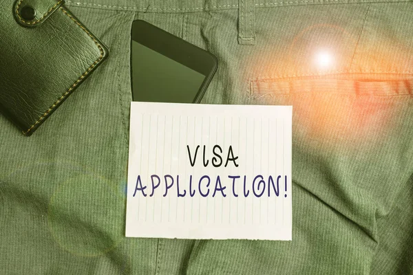 Conceptual hand writing showing Visa Application. Concept meaning Form to ask permission travel or live in another country Smartphone device inside trousers front pocket with wallet