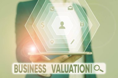 Writing note showing Business Valuation. Business concept for determining the economic value of a whole business clipart