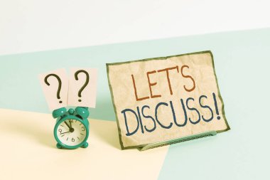 Writing note showing Let S Discuss. Business concept for asking someone to talk about something with demonstrating or showing Alarm clock beside a Paper sheet placed on pastel backdrop clipart